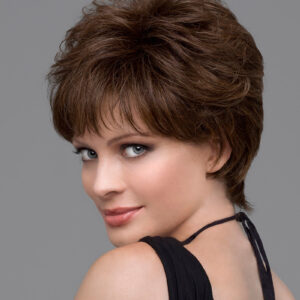 headshot of model wearing brown pixie style wig