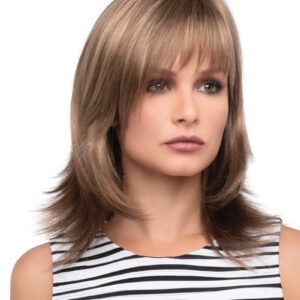 headshot of model wearing dark blonde shoulder length wig