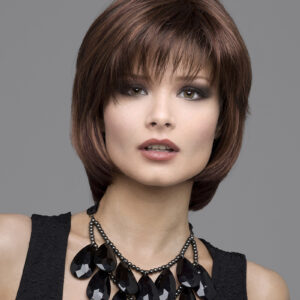 headshot of model wearing brown chin length wig