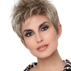 headshot of model wearing dirty blonde pixie style wig