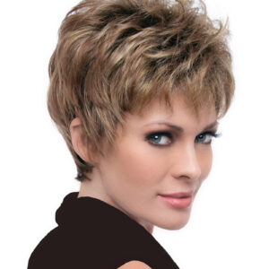 headshot of model wearing light brown pixie style wig