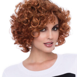 headshot of model wearing short red wig with curls