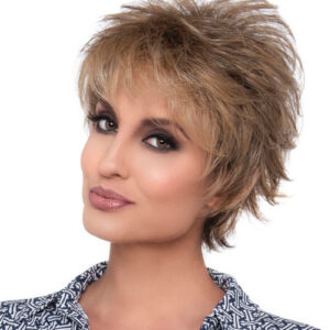 headshot of model wearing light brown spiky style wig