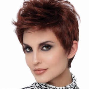 headshot of model wearing dark red spiky style wig