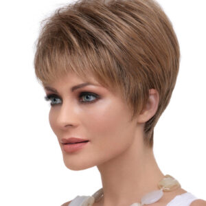 headshot of model wearing strawberry blonde pixie style wig